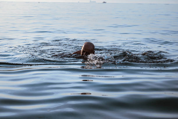 istock Senior man enjoying amazing sea vacation 1340429221