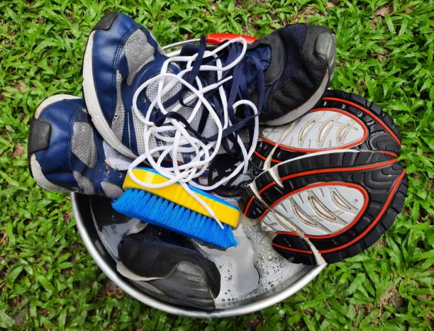 istock Washing and cleaning Sport Shoe. 1340429328