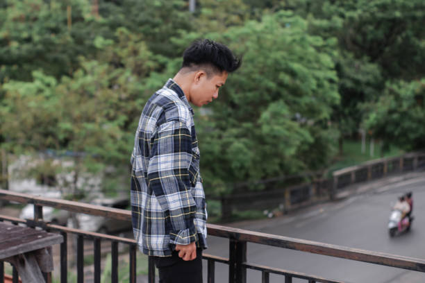 istock Young men relaxing at rooftop park city 1340431122