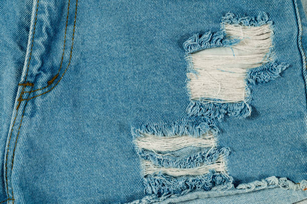 istock The textured blue jeans with torn design.concept background jeans 1340431756