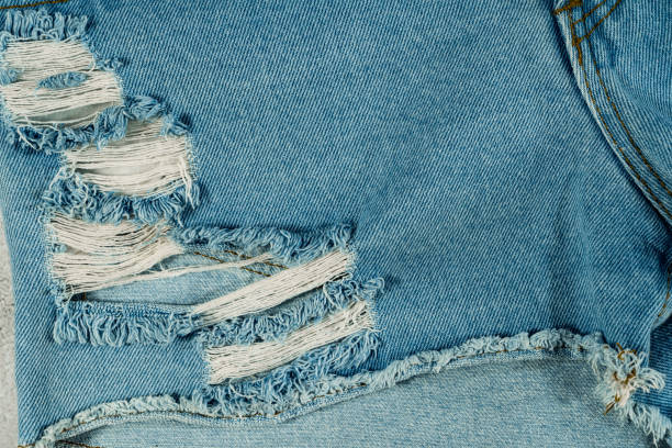 istock The textured blue jeans with torn design.concept background jeans 1340431760