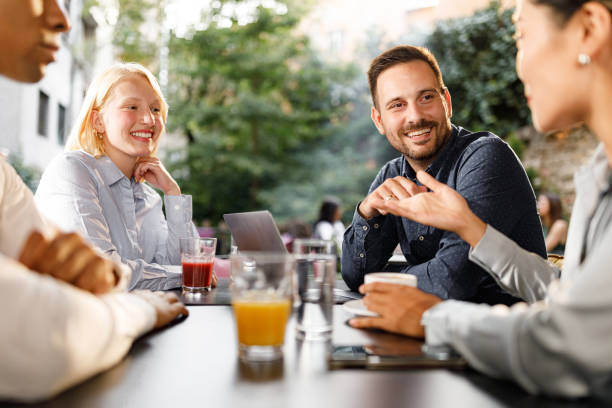 istock Happy colleagues having a casual meeting in a cafe. 1340432684
