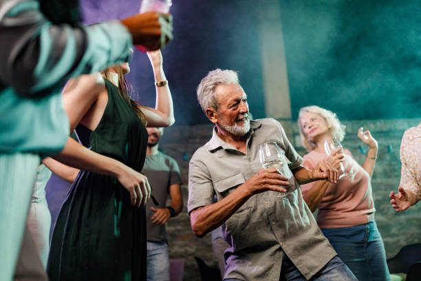 istock Mature man disco dancing during nightlife in a club. 1340433083