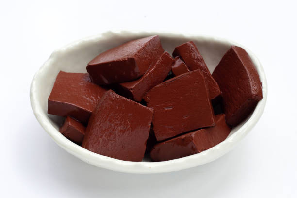 istock Pork blood pudding in white bowl on white background. 1340433418