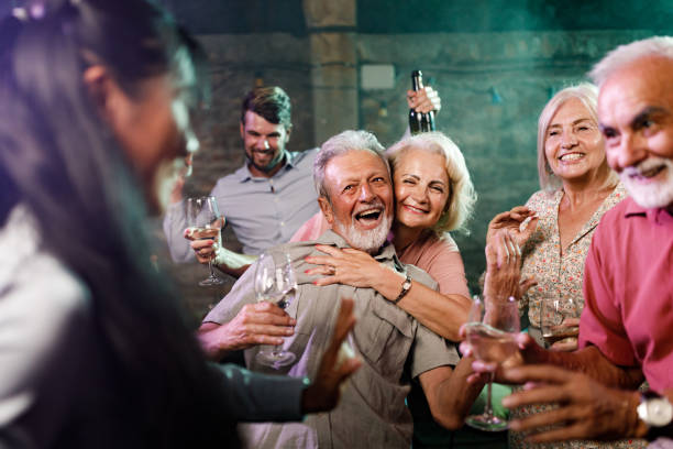 istock Happy senior couples having fun during nightlife in a club. 1340434561