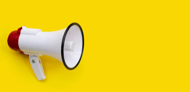 istock Red and white megaphone on yellow background. 1340435336
