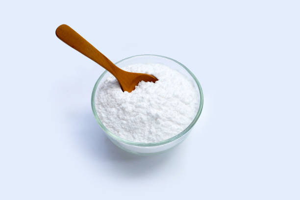 istock Baking soda in glass bowl on white background. 1340435507