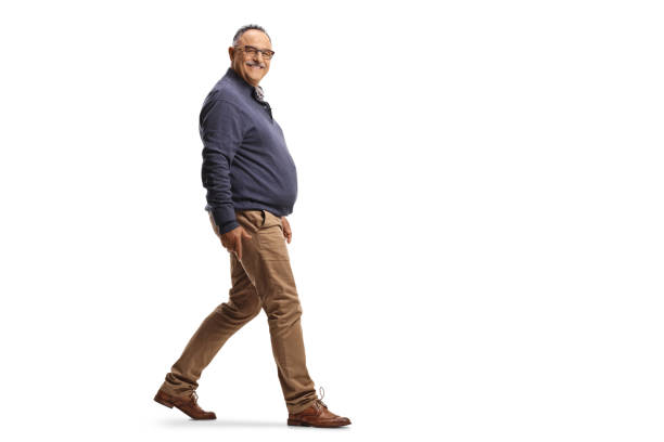 istock Full length profile shot of a mature smiling man walking 1340437310