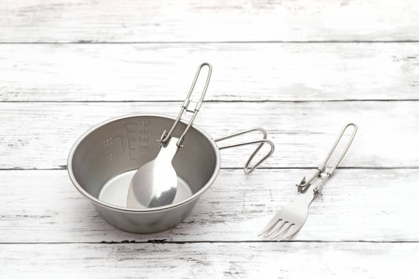 sierra cup, spoon, fork  on table stock photo