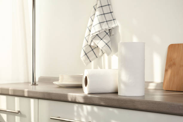 rolls of paper towels on wooden table in kitchen - pano da cozinha imagens e fotografias de stock