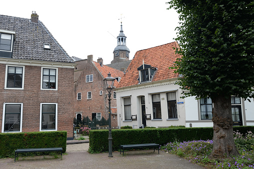 Beguinage in Breda with 29 houses around a herb garden with the Walloon church (Waalse kerk), in the background.