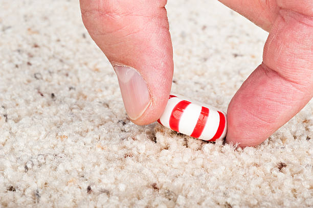 Candy stuck to carpet stock photo