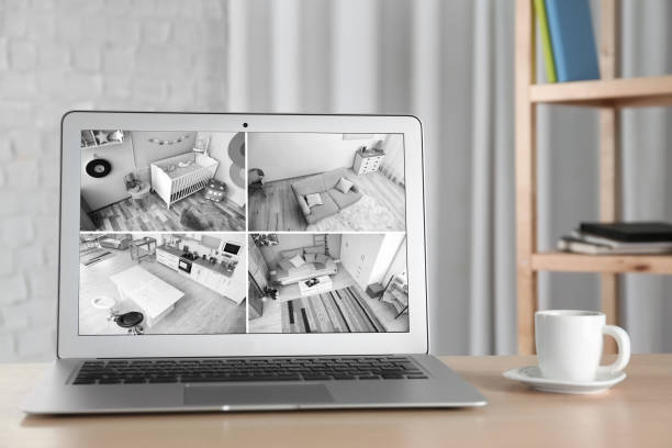 istock Laptop with view from CCTV cameras. Home security system 1340442752