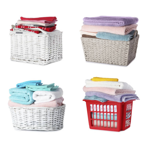 istock Set of different baskets with towels on white background 1340442848