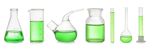 istock Set of laboratory glassware with green liquid on white background. Banner design 1340444232