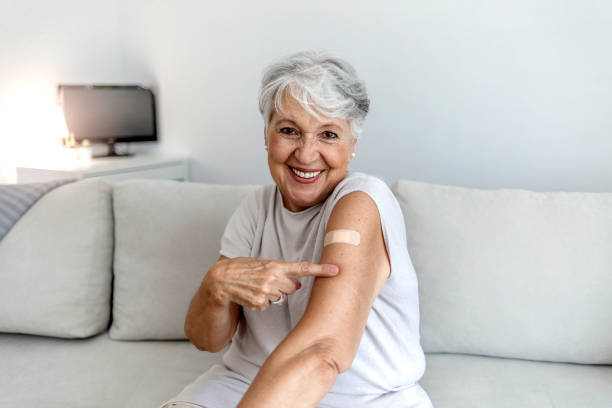 istock Elderly lady getting immunization via anti-viral vaccine. 1340445661