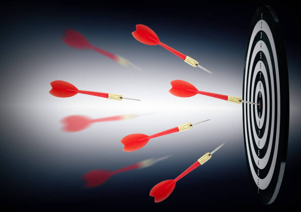 istock Board and red darts on dark background 1340446759