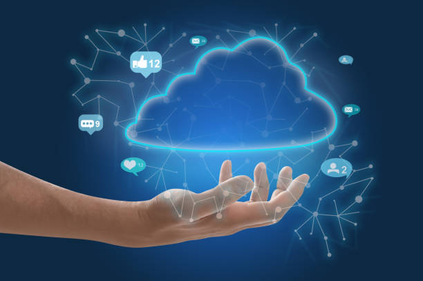 istock Man demonstrating digital cloud with icons on blue background, closeup. Modern technology 1340446905