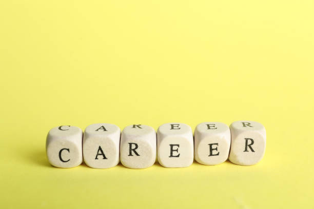 istock Stone cubes with word CAREER on yellow background. Space for text 1340447086