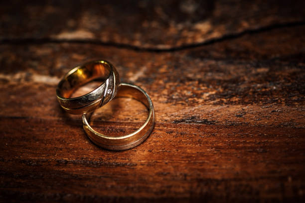 istock Two golden wedding rings 1340450350