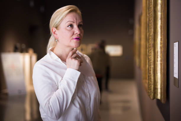 istock Closeup on mature female visiting museum 1340450466