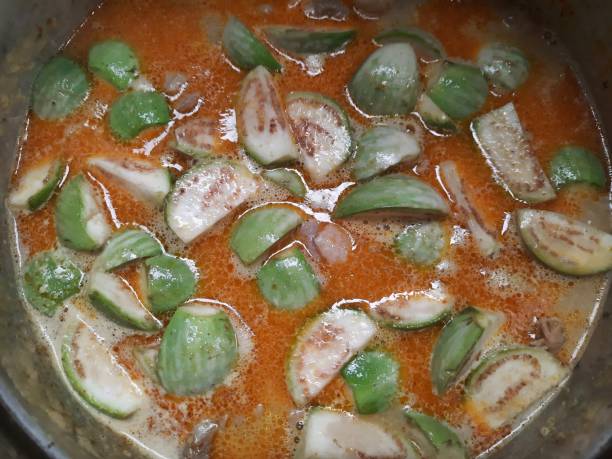 istock Making Red chicken curry on stove - Thai food preparation. 1340459526