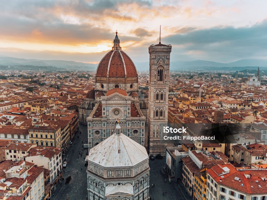 Aerial view of Piazza del Duomo in Florence, Italy Aerial view of Piazza del Duomo in Florence, Italy. Duomo di Santa Maria del Fiore, the famous Cathedral of Florence during sunrise. Florence - Italy Stock Photo