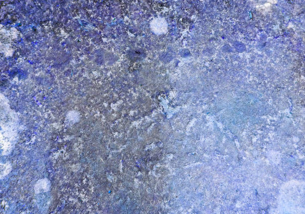 istock An old weathered stone in blue 1340463101