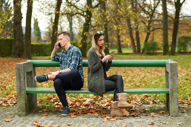 istock Displeased couple on a park bench 1340463203
