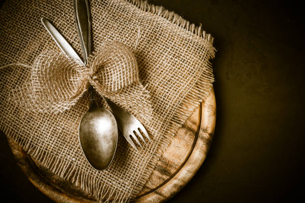 istock Vintage tableware, cutlery with wooden cutting board 1340464578