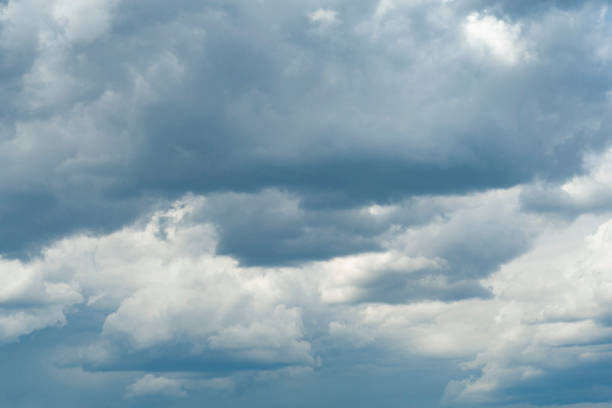 istock blue sky with dark blue, gray and white clouds with background texture 1340465900
