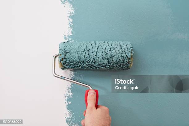 Closeup Of A Paint Roller On The Wall Stock Photo - Download Image Now - Painting - Activity, House Painter, Wall - Building Feature