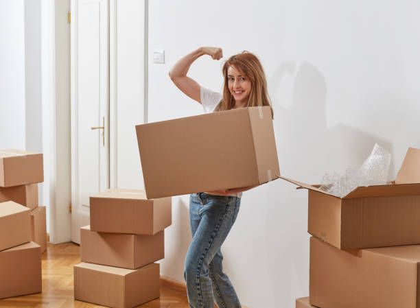 istock Young woman flexing muscle 1340466076