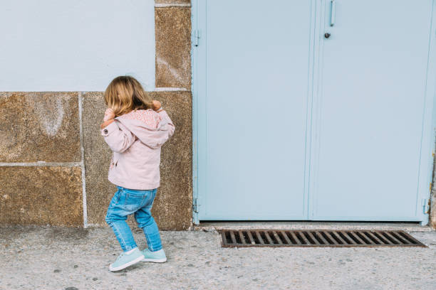 istock Little girl having fun at the railway station platform. 1340467838