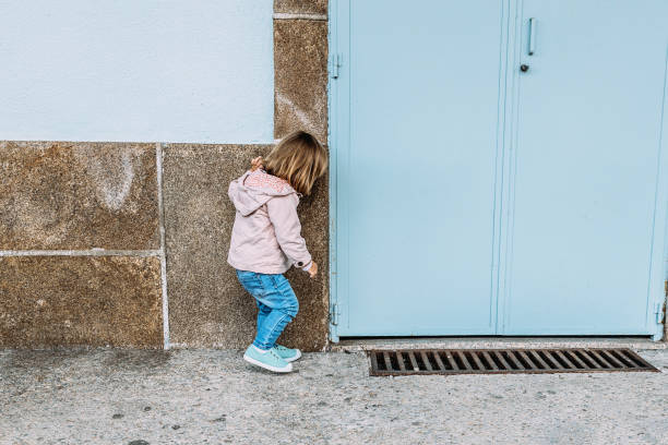 istock Little girl playing and exploring at the railway station. 1340467862