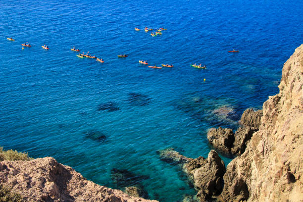 istock People practicing canoeing in the Reef of the Sirens 1340468832