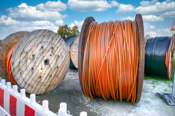 Cable drums for laying internet fiber optic cables in residential areas Cable drums for laying internet fiber optic cables in residential areas digital subscriber line stock pictures, royalty-free photos & images