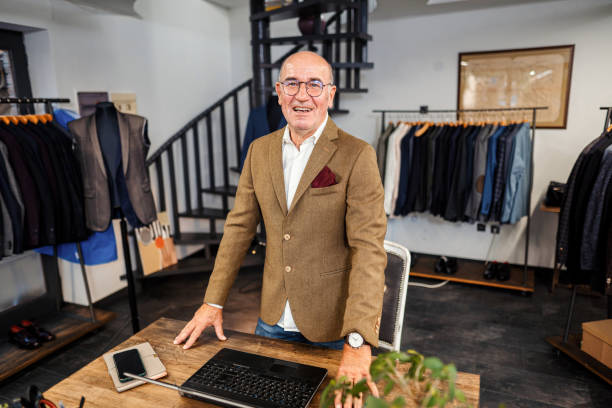 istock Senior men working at men's clothing store 1340472370