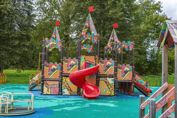 istock Empty playground in green city park in summer 1340475546
