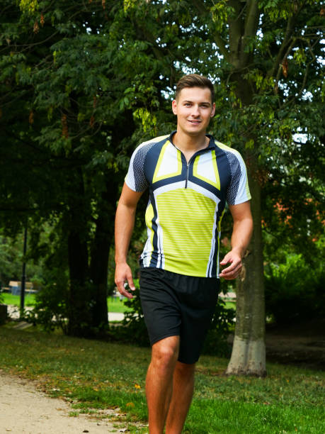 istock Young man running in park 1340477824