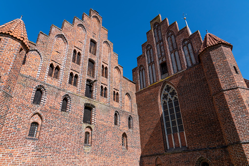 Back side of Wienhausen monastery and St. Mary's church made of bricks and various windows