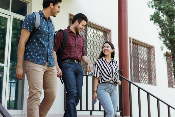 istock University students going down the stairs outside building 1340480554