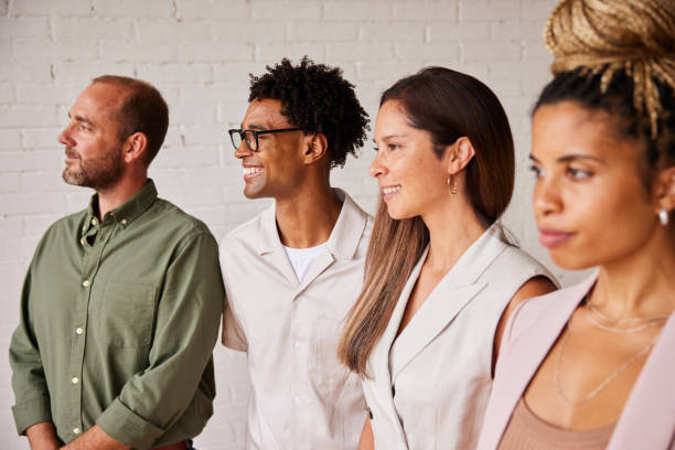 istock Diverse businesspeople standing together in an office 1340481473