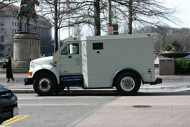 A white armored car driving through the city stock photo