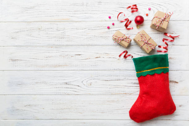 istock santa red sock top view on the color background with empty space. Christmas background 1340483401
