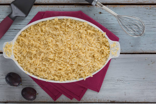 istock Grated pie with plums is prepared in the home kitchen 1340483426