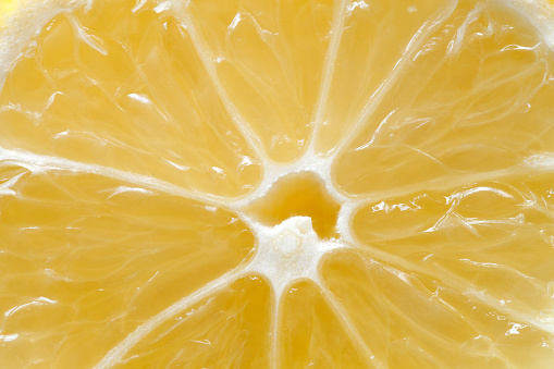 Lemon cut citrus fruit inside middle, macro close-up