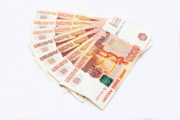 istock Some scattered Russian 5000 rubles banknotes closeup isolated on the white background 1340489110