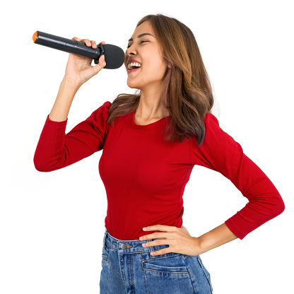 Young asian woman in red long sleeve t-shirt singing with microphone.