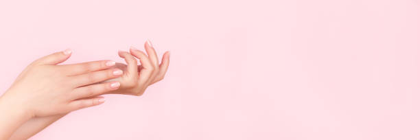 istock Female hands with nude nails 1340490908